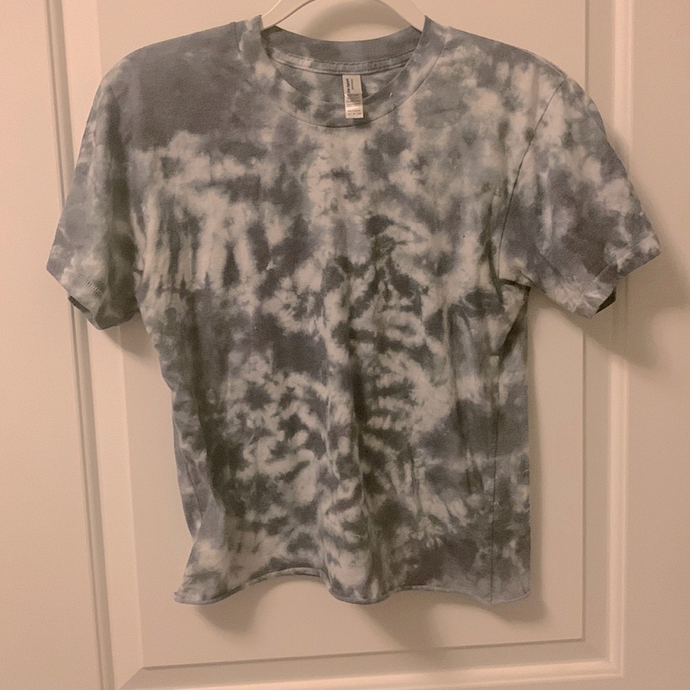 Dusty blue tie dye t shirt with raw edge hem on the bottom, lightweight